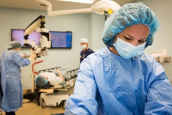 Health care professional in surgery setting with PPE
