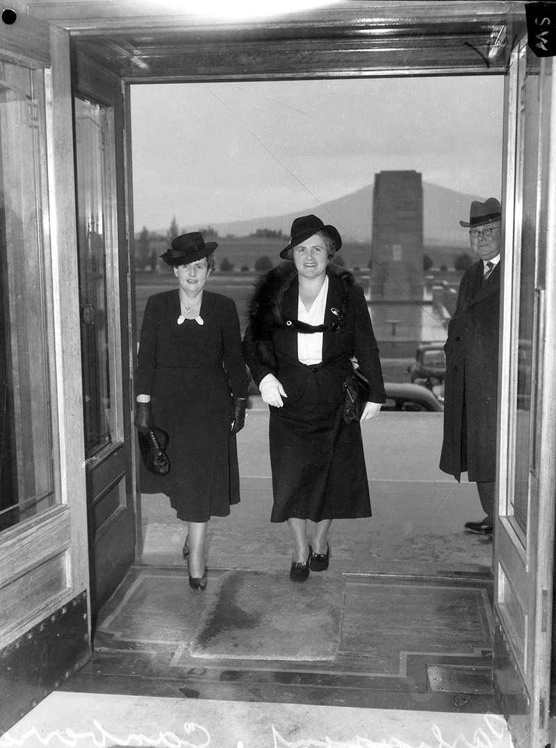 Canberra ACT 1943-09-24. Senator Dorothy M Tangney (left) and Dame Enid Lyons, GBE, Entering the front door of the House of Representatives, Australian War Memorial, 139712