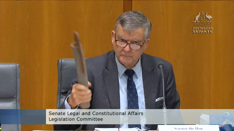 Senator Bill Heffernan with fake pipe bomb at Senate Estimates hearing, Image source: ParlView, 26 May 2014