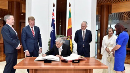 Sri Lankan Prime Minister Ranil Wickremesinghe signs the visitors’ book at Parliament House, Image source: AUSPIC