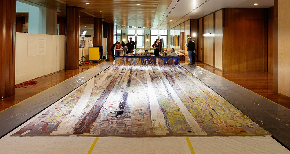 Student volunteers from the University of Canberra help to clean the Great Hall Tapestry, Image source: Parliament House Canberra, @ParlHouseCBR on Twitter 