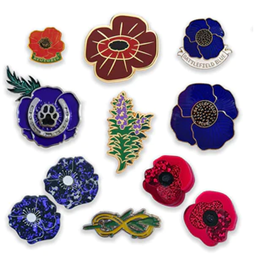 A variety of lapel pins available from the Australian War Memorial shop showing poppies and rosemary.