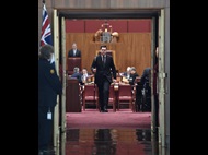 Usher of the Black Rod en route to summon members of the House of Representatives to the Senate
