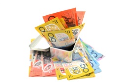 Some Australian banknotes in a metal box on white background