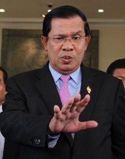 Cambodian Prime Minister Hun Sen (R) talks to the press with Sam Rainsy (L) president of the Cambodia National Rescue Party (CNRP), after the National Assembly vote to select the members of National Election Committee in Phnom Penh, Cambodia on April 9th, 2015.