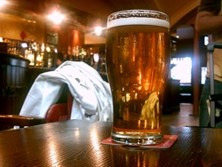 Photo of a glass of beer in a pub
