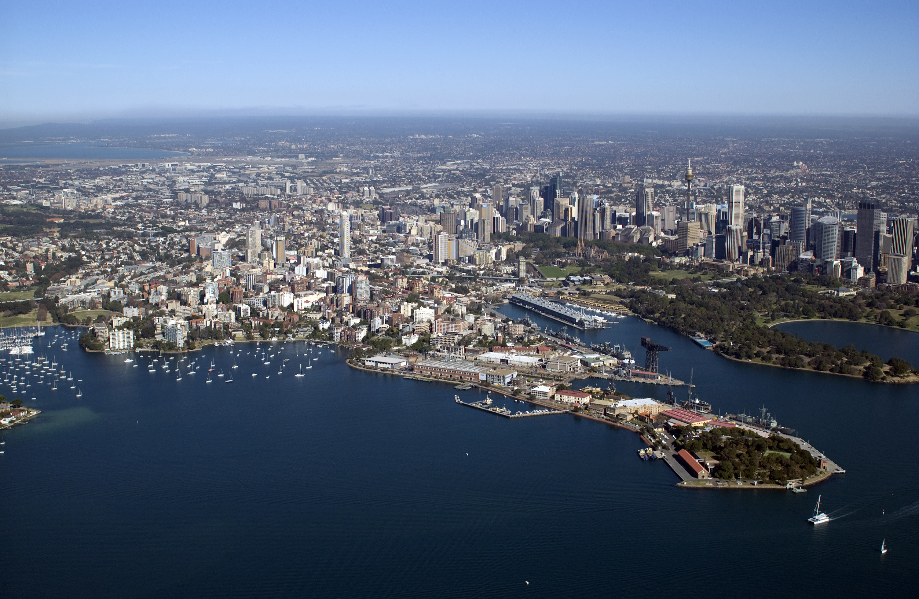 Aerial view of Sydney cityscape with iconic landmarks and harbour.
