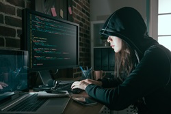 Female hacker using computer