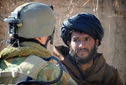 An Australian soldier talks with a Sorkh Lez local as part of a community engagement patrol, in the Mirabad Valley, during Operation Pisho (OP Sydney)