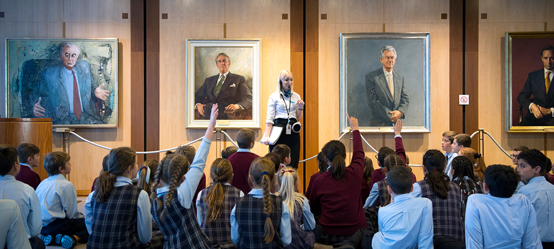School students asking questions about the Prime Minister portraits