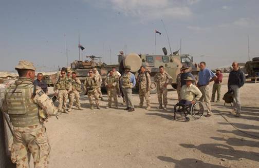 Figure 2.1 The delegation is briefed on the capabilities of the ASLAV and Bushmaster vehicles at Camp Smitty, southern Iraq