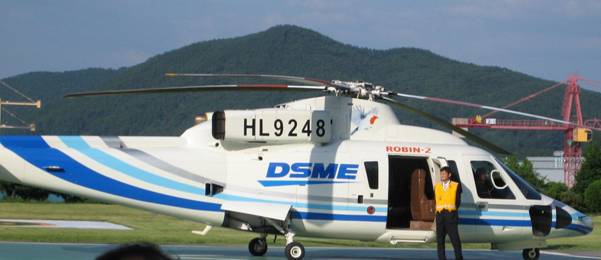 The delegation visited DSME's shipbuilding site at Okpo Bay, Geoje Island on the southeastern tip of the Korean Peninsula. Transport to the site was provided in DSME's helicopter, affording a good view of Okpo bay and the scale of DSME's shipping operation. 